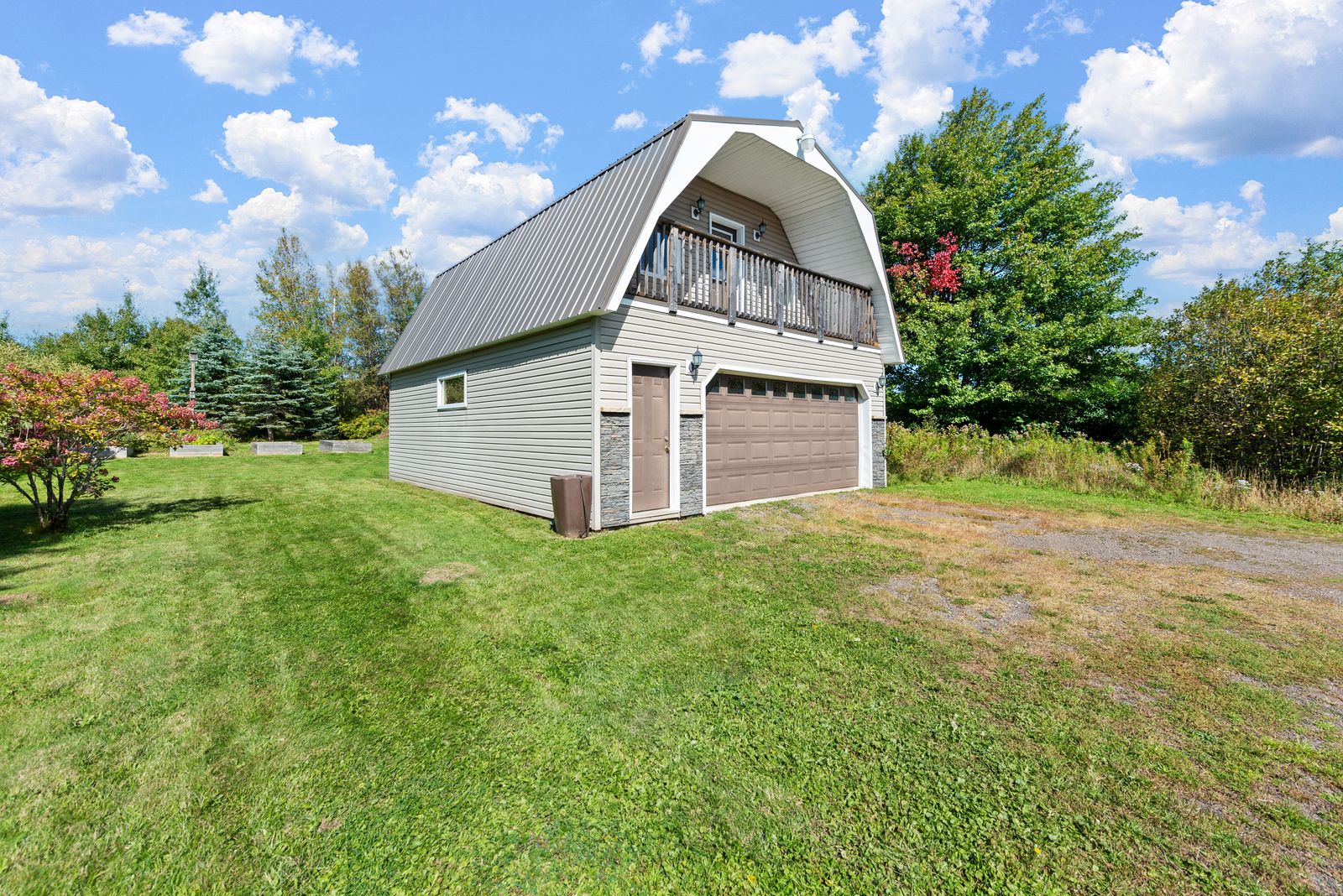 Detached gambrel-roof garage, loft balcony